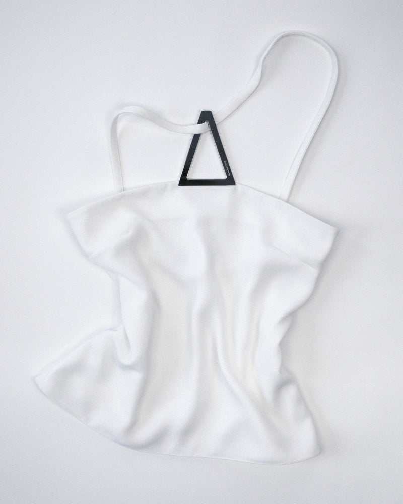 White halter top with a silver metal triangle design on a white background