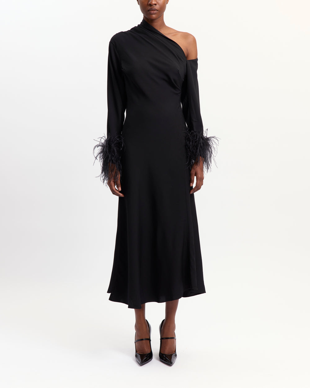 16Arlington Adelaide black crepe asymmetric off-the-shoulder dress with gathered detailing, ostrich feather-trimmed cuffs and a side split, ideal for cocktail and evening occasions from a luxury British designer brand.