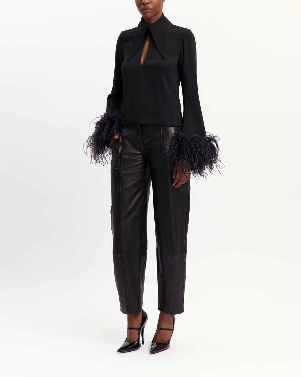 16Arlington Michelle black crepe top with oversized pointed collar, front keyhole neckline and flared sleeves with feather-trimmed cuffs, ideal for cocktail and evening occasions from a luxury British designer brand.