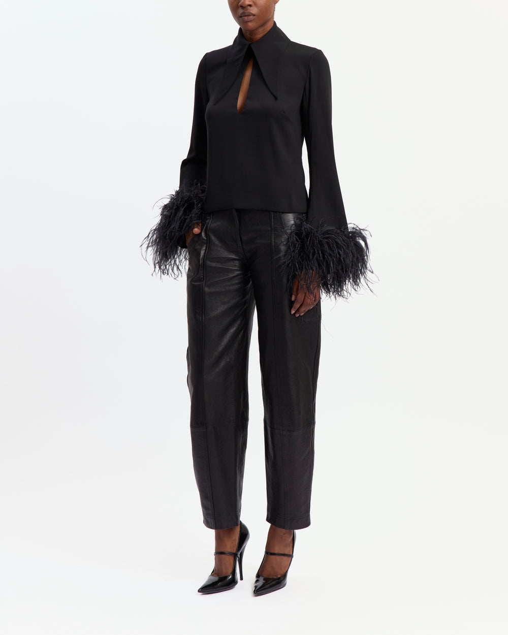 16Arlington Michelle black crepe top with oversized pointed collar, front keyhole neckline and flared sleeves with feather-trimmed cuffs, ideal for cocktail and evening occasions from a luxury British designer brand.