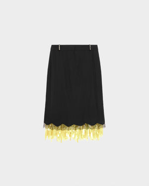 16Arlington Vea skirt in black satin, designed in a straight silhouette falling just below the knee, featuring a tailored waistband with individually applied silver rivets at each belt loop, finished with hand-applied scalloped lace trim and a contrasting chartreuse sequin panel, ideal for evening styling and occasion wear from a luxury British designer brand.