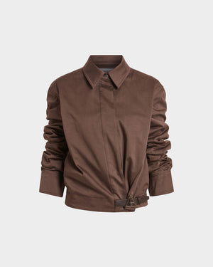 16Arlington Jolie jacket in nocciola cotton sateen, featuring a cropped silhouette with a cinched waist, plunging neckline and pointed collar with ruched sleeves and contrast leather buckle. This jacket brings signature tailoring to elevated daytime and evening looks from a luxury British designer brand.