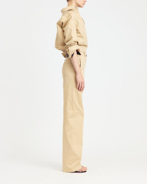 16Arlington Junia trouser in refined sabbia cotton sateen, featuring a mid-waist fit and a clean straight-leg silhouette. Designed for modern tailoring, this versatile piece reflects contemporary styling from a luxury British designer brand, ideal for elevated day-to-evening dressing. - side view