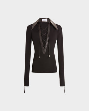 16Arlington Pia top with black smooth jersey, featuring a plunging V-neckline framed by a brown leather pointed collar with branded metal-tipped cord lacing. This refined piece brings modern tailoring to everyday and party looks from a luxury British designer brand.