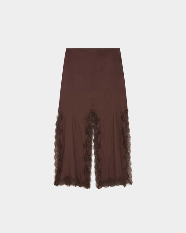 16Arlington Simi skirt in chocolate brown satin, designed in a double-layered pencil midi silhouette, featuring hand-applied scalloped lace trim and dramatic slits at the hem, ideal for evening styling and elevated everyday dressing from a luxury British designer brand.