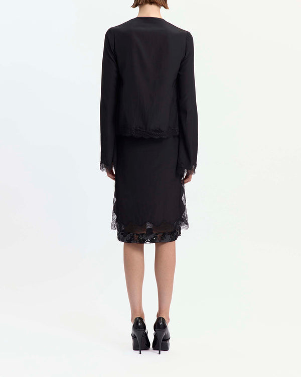 16Arlington Tirso skirt in black satin, designed in a straight silhouette falling just below the knee, featuring scalloped lace trim and a hand-embroidered sequin panel, finished with side split detailing and a tulle lining, ideal for evening styling and occasion wear from a luxury British designer brand. - back view