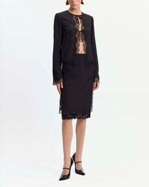 16Arlington Tirso skirt in black satin, designed in a straight silhouette falling just below the knee, featuring scalloped lace trim and a hand-embroidered sequin panel, finished with side split detailing and a tulle lining, ideal for evening styling and occasion wear from a luxury British designer brand. - front view