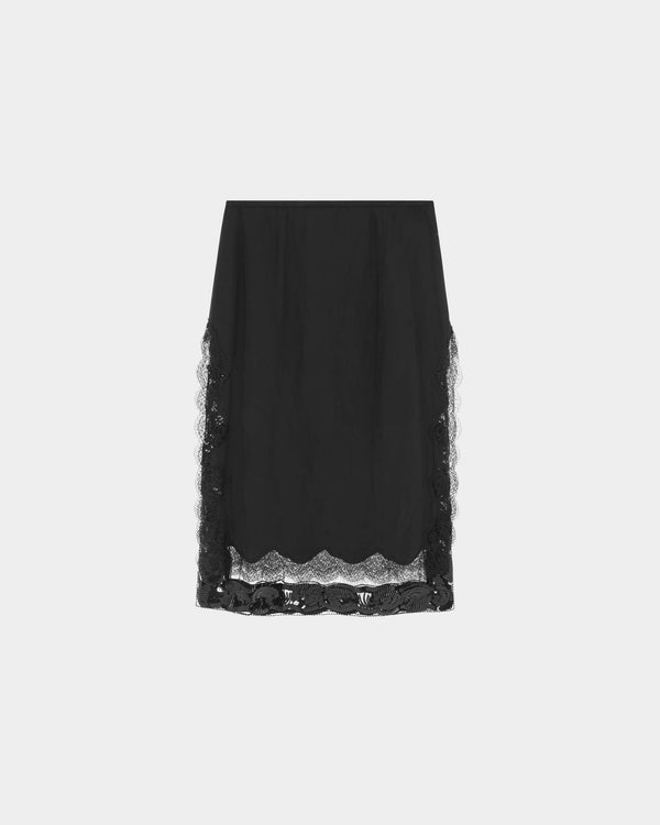 16Arlington Tirso skirt in black satin, designed in a straight silhouette falling just below the knee, featuring scalloped lace trim and a hand-embroidered sequin panel, finished with side split detailing and a tulle lining, ideal for evening styling and occasion wear from a luxury British designer brand.