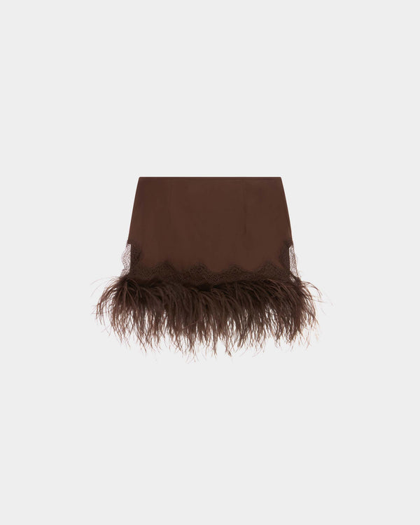 16Arlington Zelmi mini skirt in chocolate satin, designed in a low-waist silhouette cut to fall high above the knee, featuring hand-applied scalloped lace trim and a feathered hem, ideal for party wear and statement occasions from a luxury British designer brand.