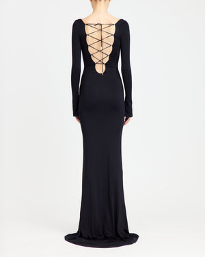16Arlington Solaris gown in black slinky jersey with long sleeves, front cut-out and plunging V-back with matching lace-up detailing, . An evening gown inspired by red carpet and after-dark occasions from a luxury British designer brand. - back view
