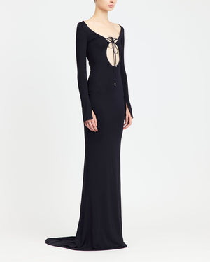 16Arlington Solaris gown in black slinky jersey with long sleeves, front cut-out and plunging V-back with matching lace-up detailing, . An evening gown inspired by red carpet and after-dark occasions from a luxury British designer brand. - side view