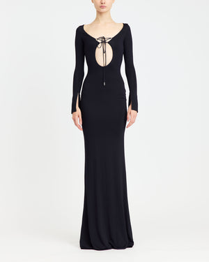 16Arlington Solaris gown in black slinky jersey with long sleeves, front cut-out and plunging V-back with matching lace-up detailing, . An evening gown inspired by red carpet and after-dark occasions from a luxury British designer brand. - front view