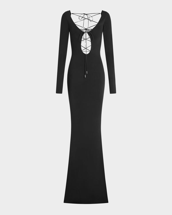 16Arlington Solaris gown in black slinky jersey with long sleeves, front cut-out and plunging V-back with matching lace-up detailing, . An evening gown inspired by red carpet and after-dark occasions from a luxury British designer brand.