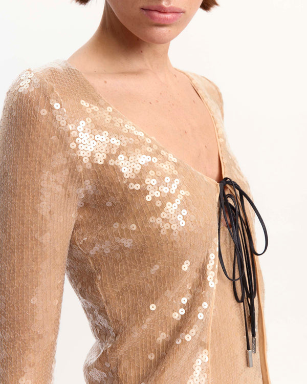 16Arlington Elin cardigan in champagne sequin fabric, designed in a minimal silhouette with a cropped bodice, long fitted sleeves and front tie detailing, ideal for evening wear, party styling and special occasions from a luxury British designer brand. - close-up