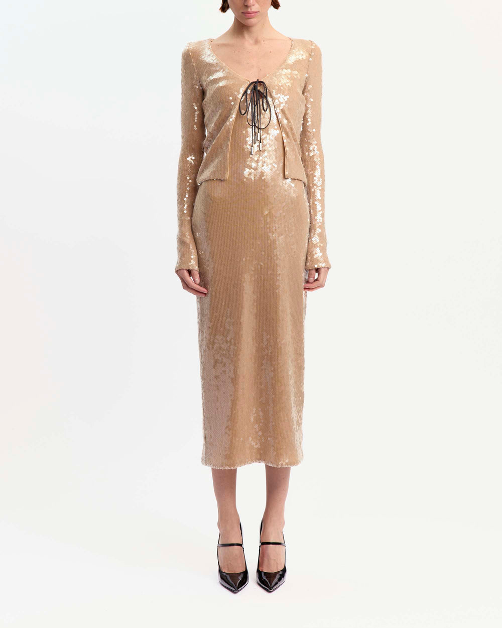 16Arlington Elin cardigan in champagne sequin fabric, designed in a minimal silhouette with a cropped bodice, long fitted sleeves and front tie detailing, ideal for evening wear, party styling and special occasions from a luxury British designer brand.