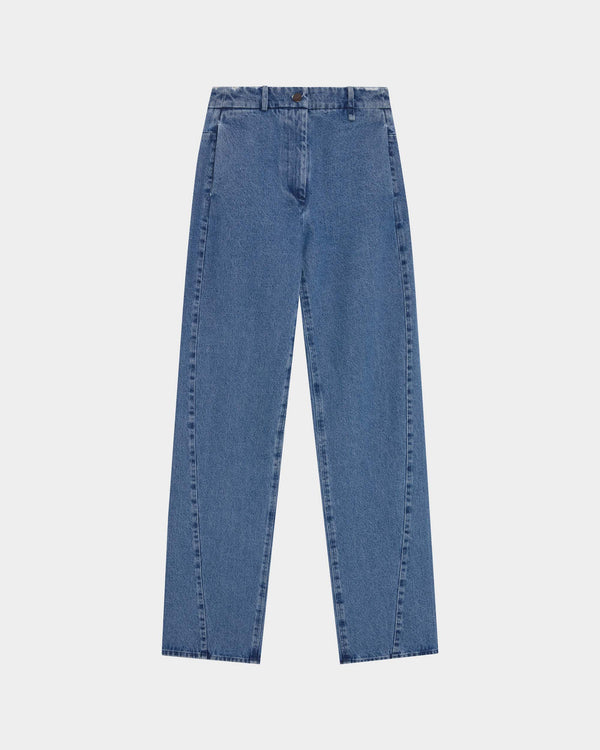 16Arlington Junia trouser in blue denim, cut in a straight-leg silhouette with a clean, structured curved seam finish, offering a refined take on with hidden in-seam pockets, ideal for day-to-evening wear and elevated casual dressing from a luxury British designer brand.