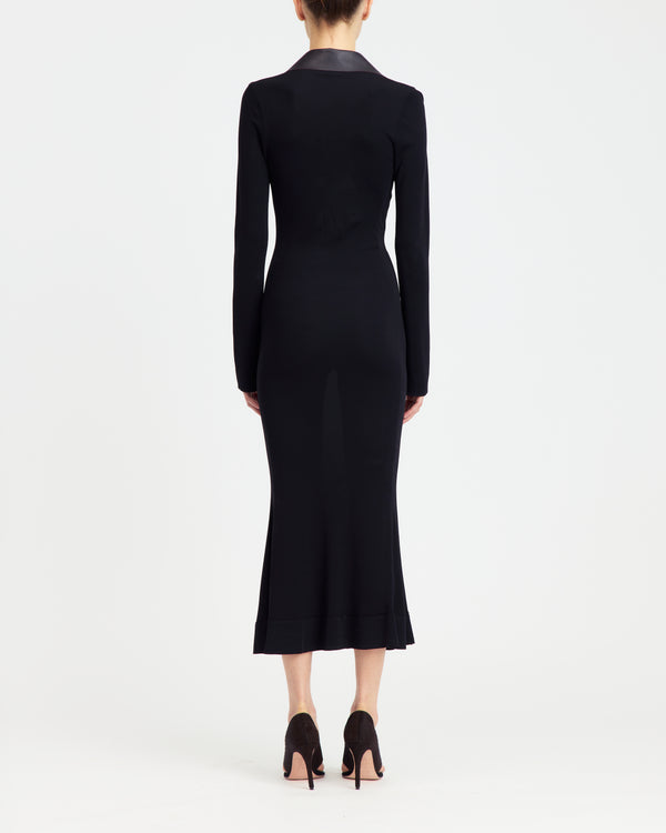 16Arlington Talia midi dress in black smooth jersey with long sleeves, a plunging V-neck framed by dark chocolate leather collar and branded metal-tipped lace-up. Inspired by modern tailoring, this dress is suited to elevated daytime occasions and evening events from a luxury British designer brand. - back view